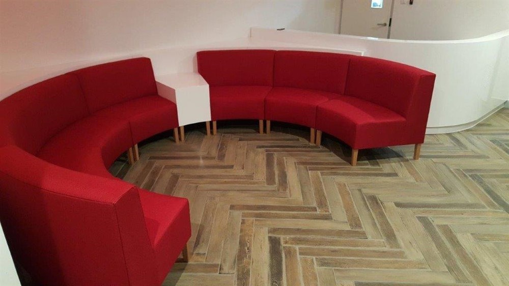 Custom banquette seating with upholstered banquette seat designed by Reality Furniture.