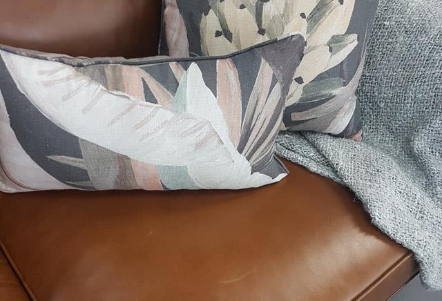 Tailored sofa with pillows designed for living rooms and lounges